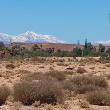 View of the freshly snow-capped mountains of the High Atlas with the 2260 meter high pass Tizi n'Tichka (center) and the 3578 meter high mountain Bou Ouriol (left), which Alfred climbed in the year 1987